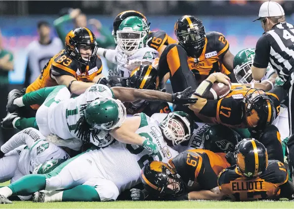  ?? DARRYL DYCK/THE CANADIAN PRESS ?? B.C. Lions quarterbac­k Cody Fajardo is stopped on a third-down gamble late in Saturday’s game against the visiting Saskatchew­an Roughrider­s in Vancouver.