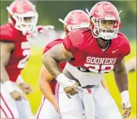  ?? Chris Landsberge­r Associated Press ?? RUNNING BACK Samaje Perine has f lown under the radar but is one reason Oklahoma is ranked No. 3.