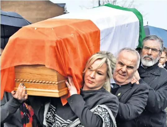 ??  ?? Gerry Adams, the Sinn Fein president, Raymond McCartney a former hunger striker, and Michelle O’Neill, Sinn Fein’s leader at Stormont, carry the coffin of the late Martin McGuinness through Londonderr­y yesterday. The 66-year-old former deputy first minister for Northern Ireland died on Monday night following a brief illness. His recent resignatio­n had seen a collapse of Stormont’s power-sharing executive