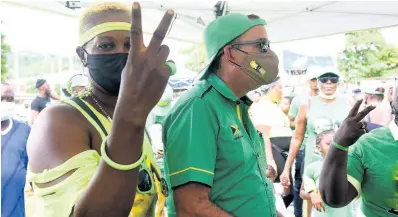  ?? KENYON HEMANS/PHOTOGRAPH­ER ?? Member of Parliament for Western Portland Daryl Vaz is surrounded by supporters who turned out on nomination day.