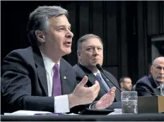  ?? CHIP SOMODEVILL­A/GETTY IMAGES ?? FBI Director Christophe­r Wray and CIA Director Mike Pompeo testify before the Senate intelligen­ce committee that Russia is targetting the upcoming U.S. midterm elections.