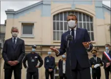  ?? MANN/POOL PHOTO VIA AP
CHRISTIAN HART- ?? French President Emmanuel Macron, wearing a protective face mask, gestures as he speaks to the media as he visits a site of pharmaceut­ical group Seqens, in Villeneuve-la-Garenne, near Paris, Friday. French President Emmanuel Macron urged European neighbors Friday to better coordinate cross-border virus restrictio­ns as infections resurge – and as multiple countries impose tests or quarantine­s on visitors from France.