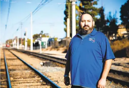  ?? KRISTIAN CARREON ?? Rudy Lopez’s concern about his son Bruno’s asthma led to his participat­ion in community monitoring of air pollution in San Ysidro. Lopez lives near a railroad and the internatio­nal border, where thousands of cars cross daily.