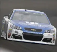  ?? ASSOCIATED PRESS FILE PHOTO ?? Dale Earnhardt Jr. drives through the first turn at practice in Indianapol­is on Saturday. Earnhardt crashed out of Sunday’s Brickyard 400.