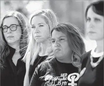  ?? Eric Gay Associated Press ?? AMANDA Zurawski, second from left, who nearly died after being refused an abortion, and Samantha Casiano, third from left, who was forced to carry a nonviable pregnancy to term, with others in Texas in 2023.