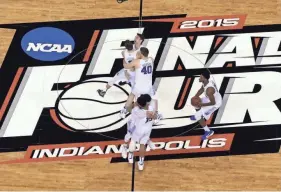  ?? DAVID J. PHILLIP/AP ?? Duke players celebrate after beating Wisconsin in the 2015 NCAA Tournament championsh­ip game in Indianapol­is.