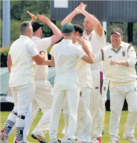  ??  ?? Bates Cottages players celebrate a wicket in their Northumber­land & Tyneside Senior League Division A2 clash against Alnwick ALL LOCAL LEAGUE PICTURES: STEVE MILLER
