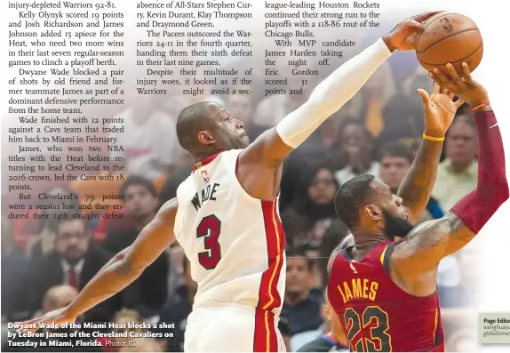  ?? Photo: IC ?? Dwyane Wade of the Miami Heat blocks a shot by LeBron James of the Cleveland Cavaliers on Tuesday in Miami, Florida.