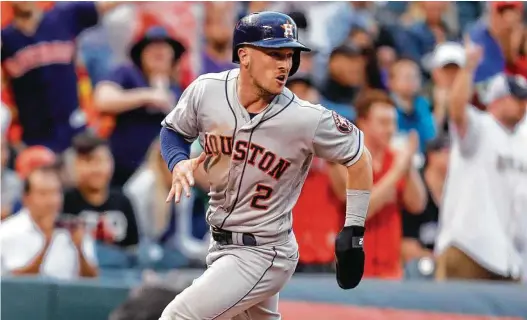  ?? David Zalubowski / Associated Press ?? Alex Bregman chugs around third to score on Jose Altuve’s double in the fourth, the Astros’ only hit on a night that was particular­ly vexing for Bregman.