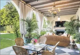  ?? Photograph­s by Simon Berlyn ?? THE PROPERTY listed by Sharon and Ozzy Osbourne spans 11,500 square feet with six bedrooms and nine bathrooms. In back is a pool, gardens and a fountain.