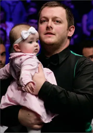  ??  ?? Mark Allen celebrates with his daughter after beating Kyren Wilson in the final of The Masters.