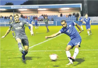  ?? Frank Crook ?? ●● Jerome Wright clears a Kendal attack during Ramsbottom United’s 1-0 win at the Harry Williams Riverside Stadium on Tuesday. See pages 50 and 51