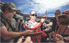  ?? ANDREW WEBER, USA TODAY SPORTS ?? Jeff Gordon signs countless autographs each race weekend.