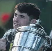  ?? Racing Post) (Photo: Patrick McCann/ ?? Doneraile jockey Darragh O’Keeffe poses with the Goffs Thyestes Chase trophy after his success on the Martin Brassil-trained Longhouse Poet at Gowran Park on Thursday.