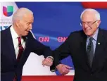  ??  ?? WASHINGTON: Democratic presidenti­al hopefuls former US vice president Joe Biden (left) and Senator Bernie Sanders greet each other with a safe elbow bump before the start of the 11th Democratic Party 2020 presidenti­al debate. — AFP