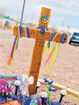  ?? COURTESY OF JORGE AND MARIA HERNANDEZ ?? A colorful descanso featuring peace signs, angels and flowers marks the spot off U.S. 60 in Socorro where Alex Hernandez, a New Mexico Institute of Mining and Technology student, was struck and killed Jan. 9, 2016.