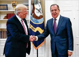  ?? RUSSIAN FOREIGN MINISTRY / VIA AP ?? President Donald Trump shakes hands in the Oval Office with Russian Foreign Minister Sergey Lavrov last week. Anonymous sources told The Washington Post that Trump discussed classified Islamic State intelligen­ce with Lavrov.