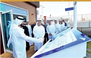  ??  ?? Mattar Al Tayer with the RTA officials during the opening of the first floating marine station in Dubai.