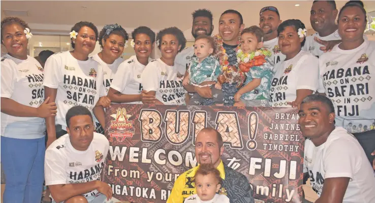  ?? Photo: Waisea Nasokia ?? Springbok rugby legend Bryan Habana holding his two sons, Gabriel and Timothy, with fans on arrival at the Nadi Internatio­nal Airport on January 13, 2019.