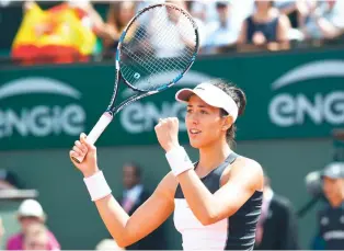  ??  ?? Spain's Garbine Muguruza celebrates after winning her tennis match against Estonia's Anett Kontaveit at the Roland Garros 2017 French Open on Wednesday in Paris. (AFP)