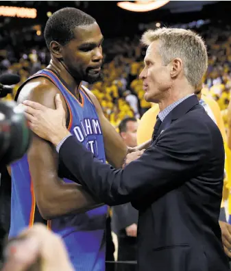  ?? Scott Strazzante / The Chronicle 2016 ?? Warriors head coach Steve Kerr speaks with Kevin Durant after Golden State beat the Thunder in Game 7 of the 2016 conference finals. Durant would join the Warriors that offseason.