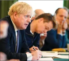 ??  ?? EMErGENCY pOWErS: PM Boris Johnson at No10 yesterday