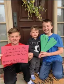  ?? SUBMITTED PHOTOS ?? From left, Cole, Callah and Cade Shamblen, members of Russellvil­le First United Methodist Church, display the work they did for the front door of their house. Members of the church are decorating their doors to celebrate Easter.