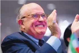  ?? ANDREW HARNIK/ASSOCIATED PRESS ?? Rudy Giuliani, President Donald Trump’s new attorney, applauds at the Iran Freedom Convention for Human Rights and Democracy in Washington on Saturday.