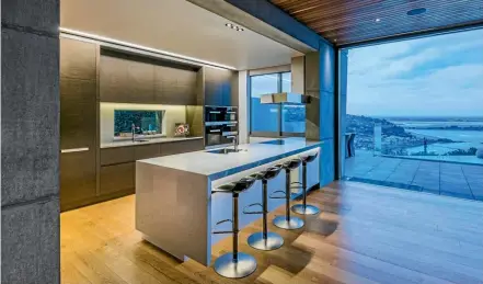  ??  ?? Vicki Andrews of Christchur­ch specified a full complement of Miele appliances and a custom canopy extractor with remote motor for this kitchen, which won the Master Joiners Best Kitchen award for 2016. The kitchen also won Andrews the NKBA award for...