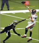  ?? TYLER KAUFMAN — THE ASSOCIATED PRESS ?? QB Tom Brady, right, is harassed during his Buccaneers debut by Saints safety Malcolm Jenkins during Sunday’s loss.