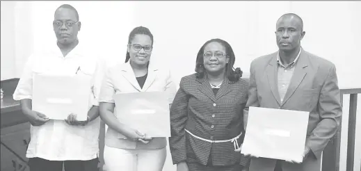  ?? (Photo by Keno George) ?? The newly sworn in commission­ers for the inquiry into the circumstan­ces surroundin­g the detention and release of an unnamed private vessel in Guyana’s waters last month. From left are Assistant Commission­er of Police (Ret’d) Winston Cosbert, Ministry...