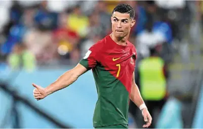  ?? — AFP ?? Count on me: Portugal forward Cristiano ronaldo gives a thumb up as he leaves the pitch at Stadium 974.