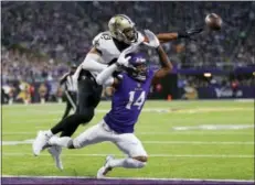  ?? CHARLIE NEIBERGALL — THE ASSOCIATED PRESS ?? New Orleans Saints free safety Marcus Williams (43) breaks up a pass intended for Minnesota Vikings wide receiver Stefon Diggs (14) during the first half of an NFL divisional football playoff game in Minneapoli­s, Sunday.