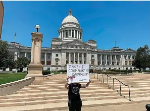  ?? (AP Photo/Andrew DeMillo, File) ?? A demonstrat­or holds a sign on June 24, 2022, outside the Arkansas state Capitol in Little Rock protesting the U.S. Supreme Court’s decision overturnin­g Roe v. Wade. A monument marking the number of abortions performed in Arkansas before Roe v. Wade was struck down would be built near the state Capitol under a bill lawmakers sent to Gov. Sarah Huckabee Sanders on Tuesday.