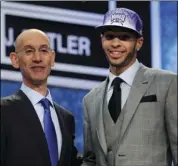  ??  ?? In this June 23, 2011, file photo, NBA Deputy Commission­er Adam Silver (left) poses with No. 35 overall draft pick, UCLA’s Tyler Honeycutt, who was selected by the Sacramento Kings in the NBA basketball draft in Newark, N.J.