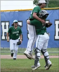  ?? ?? Lake Orion pitcher Casey Robertson jumps into the arms of catcher Antonio Grazioli after finishing off the Dragons’ 11-1 win over Rochester Adams in a Division 1regional semifinal game on Wednesday at Rochester High School.