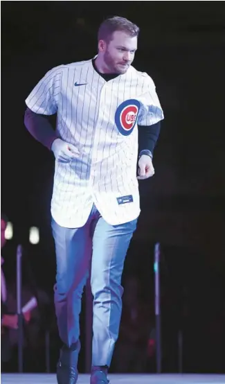  ?? JOHN J. KIM/CHICAGO TRIBUNE PHOTOS ?? Cubs outfielder Ian Happ is introduced at the opening ceremony of the Cubs Convention on Friday at the Sheraton Grand Chicago.
