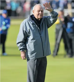  ?? KIRKGLYN KIRK/GETTY IMAGES ?? Golfing icon Arnold Palmer is shown waving to fans during the Champion Golfers’ Challenge on The Old Course at St Andrews, Scotland, in July 2015. Palmer died at the age of 87 on Sunday.