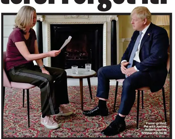  ?? ?? Flame-grilled: PM with Justine Roberts by the fireplace in No 10