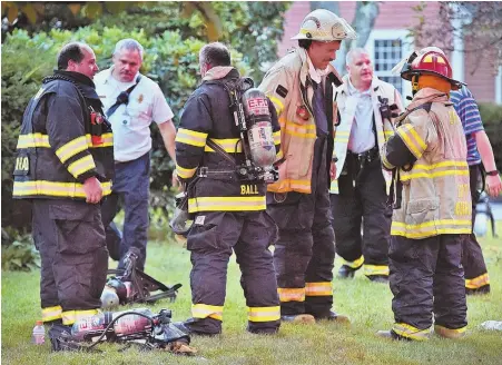  ?? STAFF PHOTO BY PATRICK WHITTEMORE ?? STRONG RESPONSE: First responders work at a Green Street residence in North Andover in the wake of reports of a gas line failure and explosions yesterday.