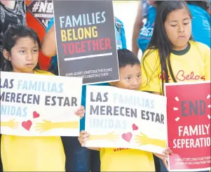  ?? AP PHOTO ?? Children hold signs during a demonstrat­ion in front of the Immigratio­n and Customs Enforcemen­t offices in Miramar, Fla.