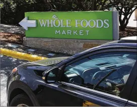  ?? NICK WAGNER / AMERICAN-STATESMAN ?? Three shareholde­r lawsuits seek to block the acquisitio­n of Whole Foods Market by Amazon. Whole Foods has not commented on the suits.