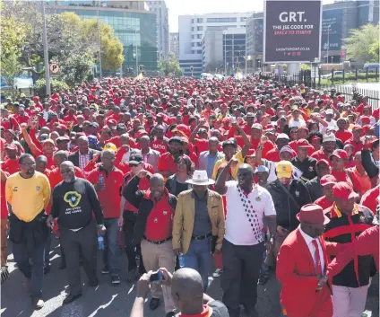  ?? Picture: Refilwe Modise ?? MASSES RISE. Cosatu members during a May Day march to the Johannesbu­rg Stock Exchange in Sandton yesterday.