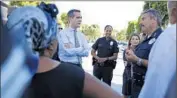  ?? Barbara Davidson
Los Angeles Times ?? MAYOR Eric Garcetti, center, and police Chief Charlie Beck, right, are working to curb violence in L.A.