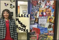  ?? Special to the MDR ?? Malvern Middle School teacher Claudine James stands beside her door which is decorated for Black History Month.