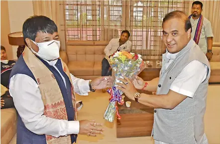  ?? PTI ?? Senior BJP leader and convener of North East Democratic Alliance (NEDA) Himanta Biswa Sarma being greeted by AGP president Atul Bora after BJP’s win in the Assam Assembly elections, in Guwahati on Monday. —