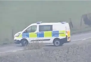  ??  ?? ●
Police at the scene after the crash on the A5025 near Menai Bridge