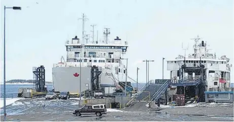  ?? FILE PHOTO ?? The MV Confederat­ion, left, and Holiday Island are shown at the Wood Islands, P.E.I. ferry terminal.