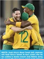  ?? ?? BRISTOL: South Africa’s Wayne Parnell (left) celebrates with South Africa’s Quinton de Kock (center) after the two combine to dismiss Ireland’s Andy McBrine during the second T20 internatio­nal cricket match between Ireland and South Africa on August 5, 2022. —AFP