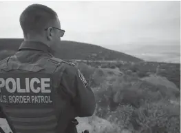  ?? Tribune News Service/the San Diego Union-tribune ?? United States Border Patrol tours an area where larger number of noncitizen­s are making multiple border crossing attempts. Border Patrol agent Jeff Stephenson looks over some trails at Otay Mountain on June 8, 2021, in San Diego.